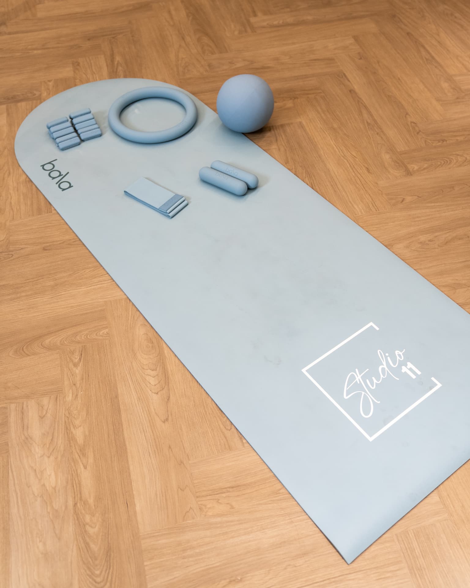 Studio 11 branded training mat and EMS workout equipment
