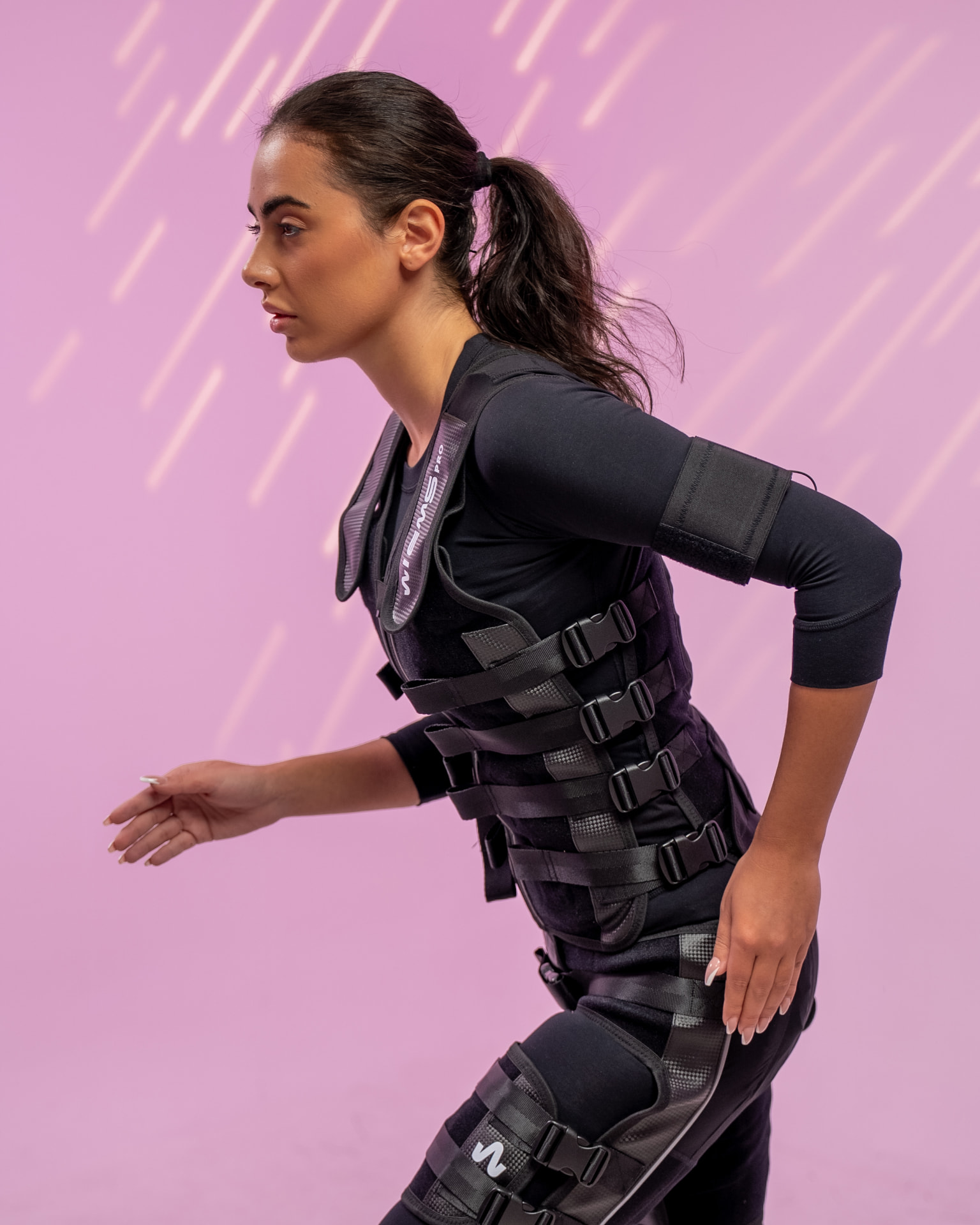 Studio 11 client in an EMS suit during a private session
